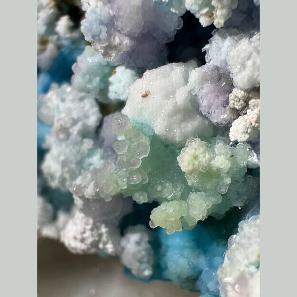 Blue-White Gibbsite with Purple and Green Inclusions Guizhou 5.0 cm — detail view