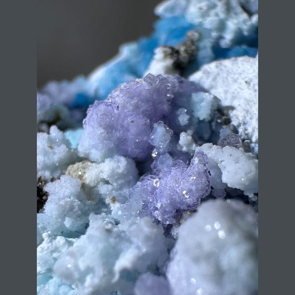 Blue-White Gibbsite with Purple and Green Inclusions Guizhou 5.0 cm — detail view