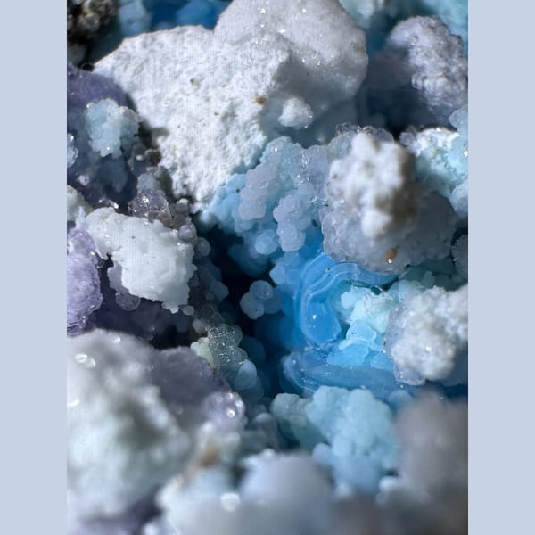 Blue-White Gibbsite with Purple and Green Inclusions Guizhou 5.0 cm — detail view