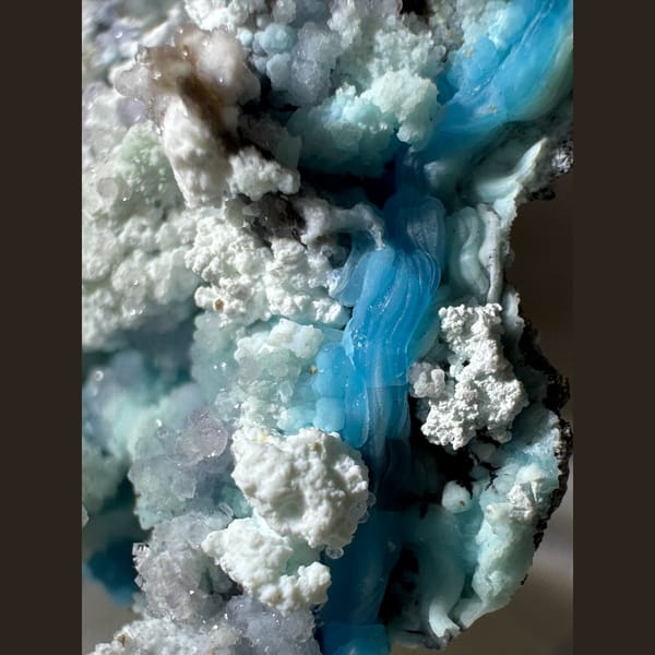 Blue-White Gibbsite with Purple and Green Inclusions Guizhou 5.0 cm — detail view