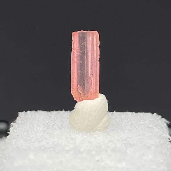 Tiny pink vayrynenite crystal from Pakistan — complete view