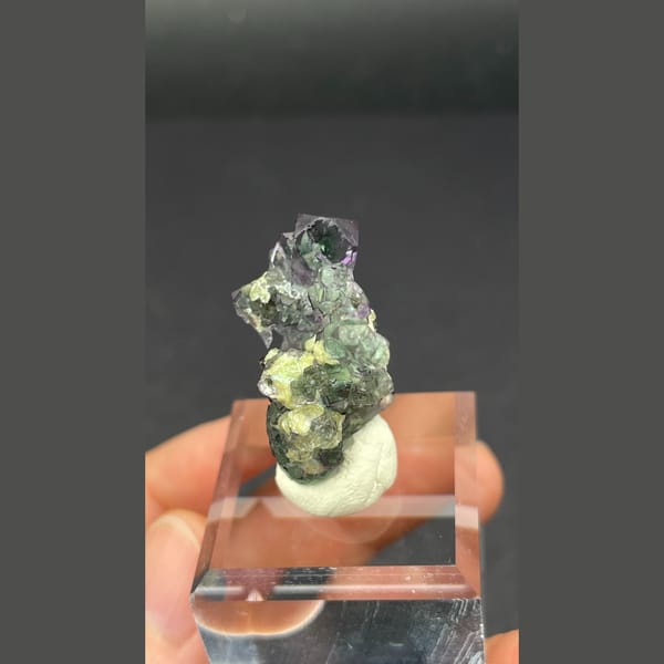 Clear faintly lilac fluorite with yellow mica from Namibia — detail view