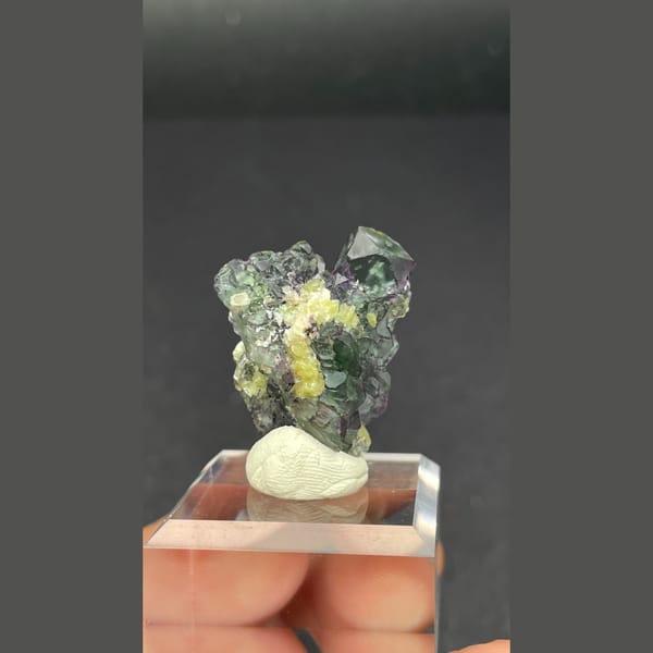 Clear faintly lilac fluorite with yellow mica from Namibia — detail view