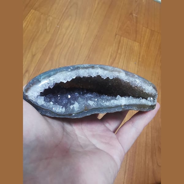 Wide-mouth amethyst geode with polished exterior — alternate view