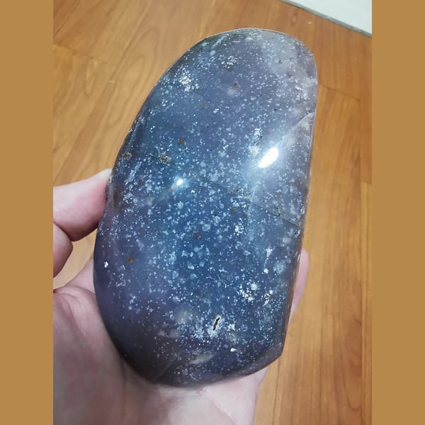 Wide-mouth amethyst geode with polished exterior — detail view