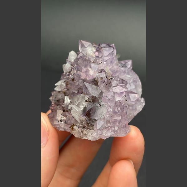 Lilac amethyst crystal group with calcite from Brazil — complete view