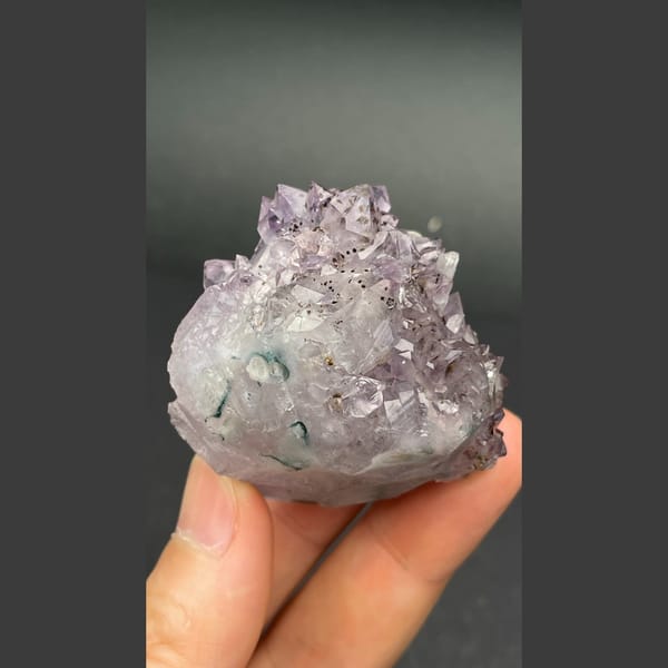 Lilac amethyst crystal group with calcite from Brazil — detail view
