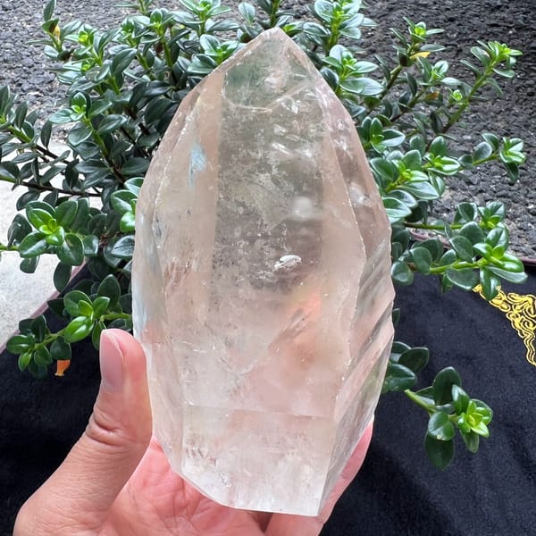 Bright striated clear quartz crystal with rainbows from Brazil — alternate view
