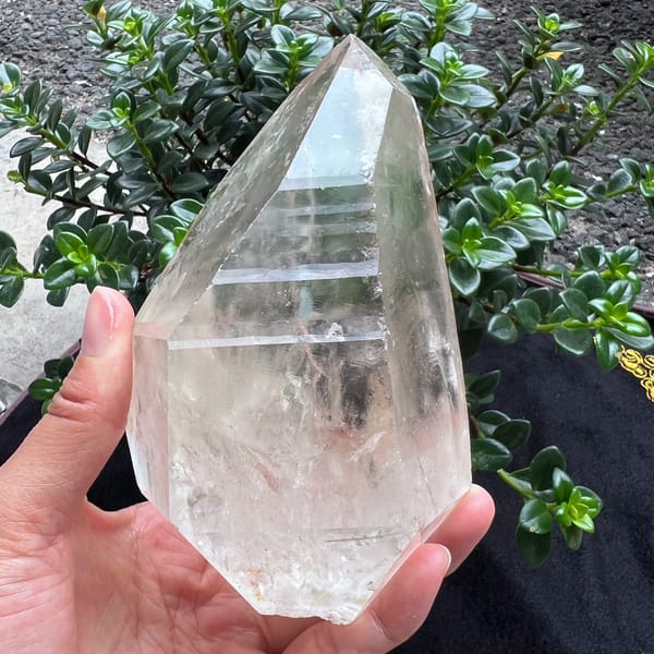 Bright striated clear quartz crystal with rainbows from Brazil — alternate view