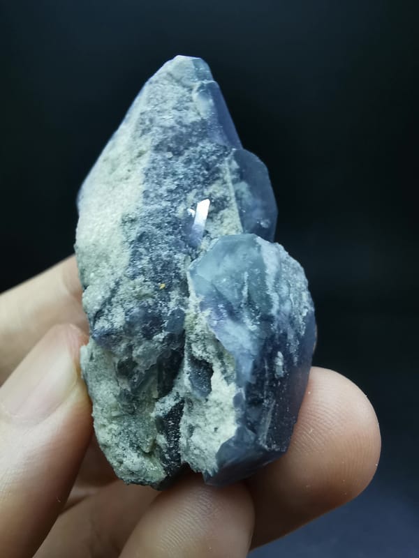 Complete side profile showing frosted blue-purple fluorite crystals