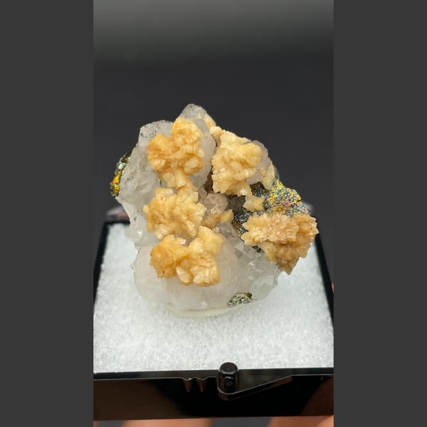 Creamy dolomite balls on quartz with chalcopyrite and pyrite from Jiangxi — detail view