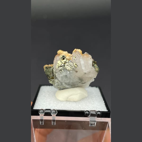 Creamy dolomite balls on quartz with chalcopyrite and pyrite from Jiangxi — detail view