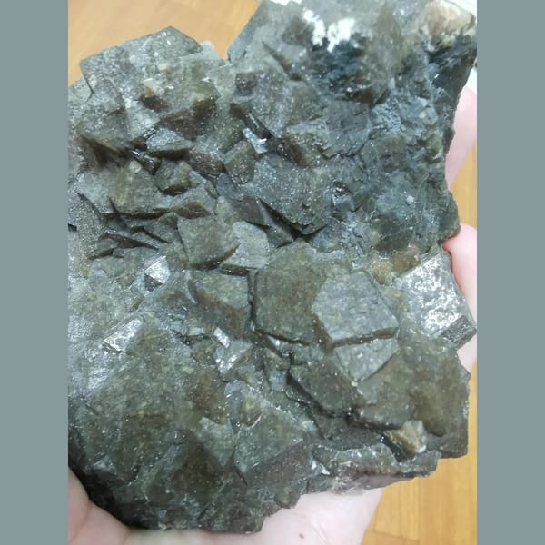 Lustrous brown-green garnet cluster — alternate view