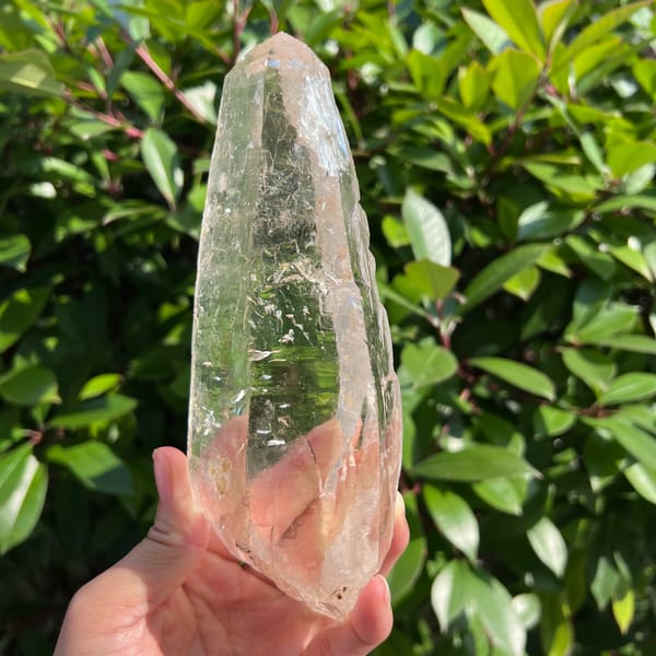 Tall near-clean clear Himalayan quartz crystal — alternate view