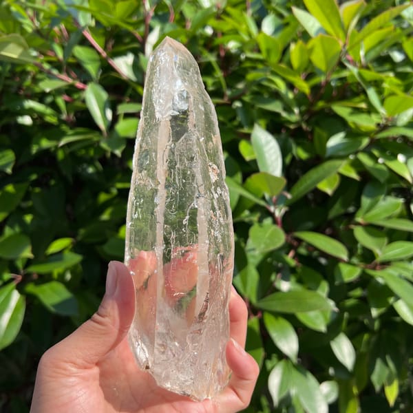Tall near-clean clear Himalayan quartz crystal — alternate view