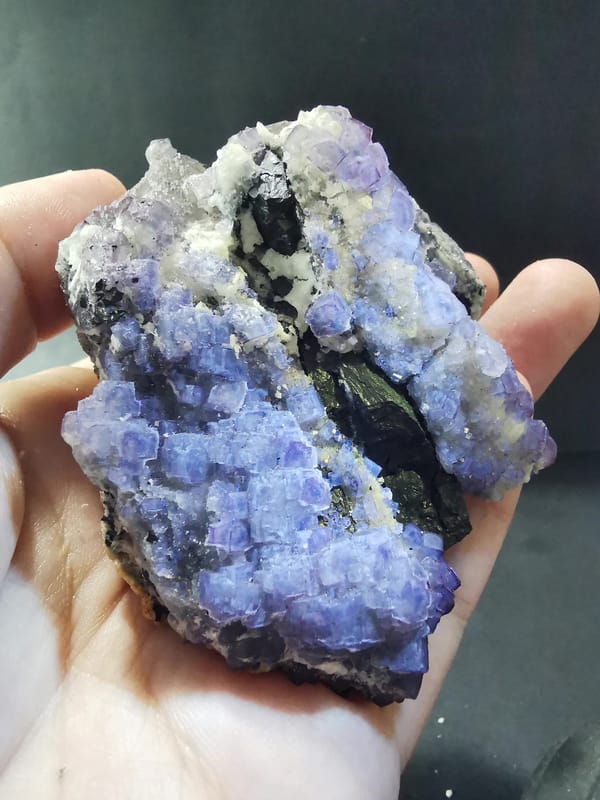 Bright complete display view of purple-green stepped fluorite crystals