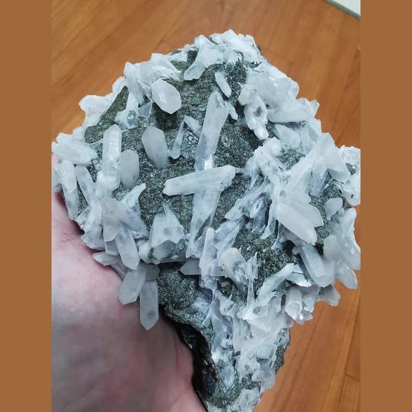 Large green andradite with interference quartz and calcite plates — alternate view