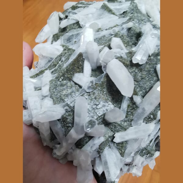 Large green andradite with interference quartz and calcite plates — alternate view