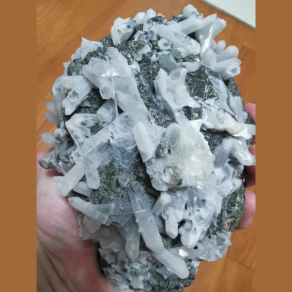 Large green andradite with interference quartz and calcite plates — detail view