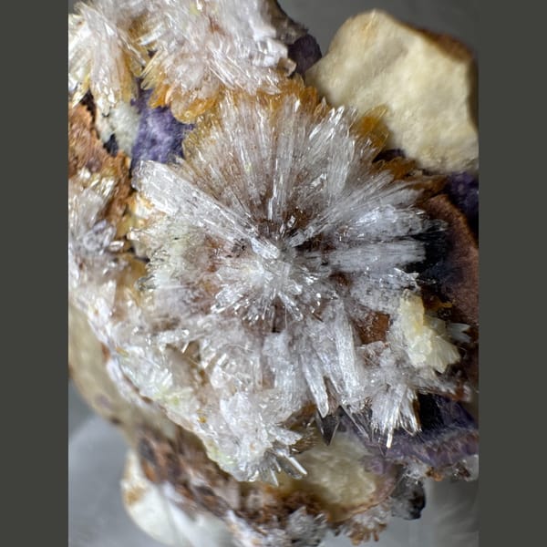 Creedite Starbursts on Purple Fluorite 5.5 cm — detail view