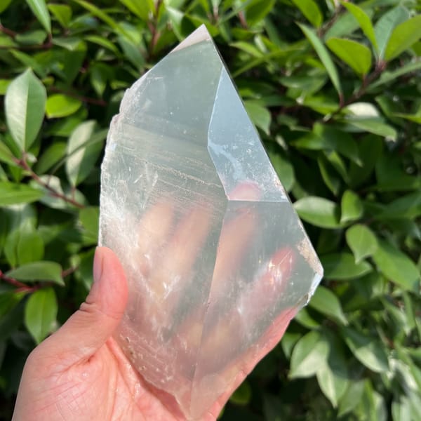 Large bright clear quartz crystal — complete view