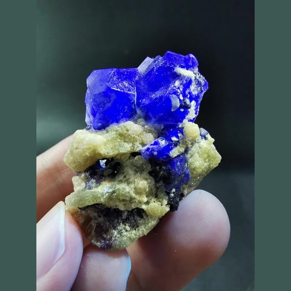 Blue-green fluorite with mica — detail view
