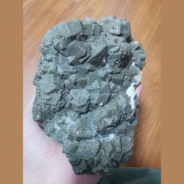 Large brown-green andradite with green quartz and goethite — complete view