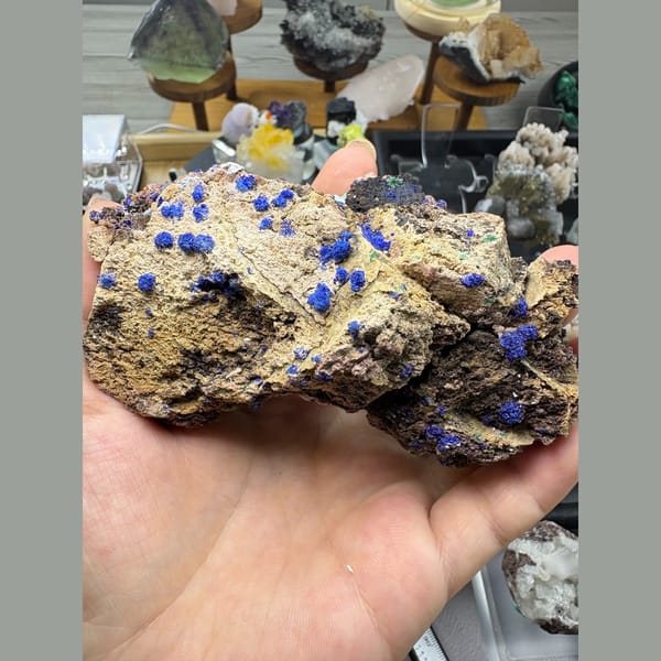 Deep blue azurite spheres with gibbsite on matrix from Qinglong, Guizhou — complete view
