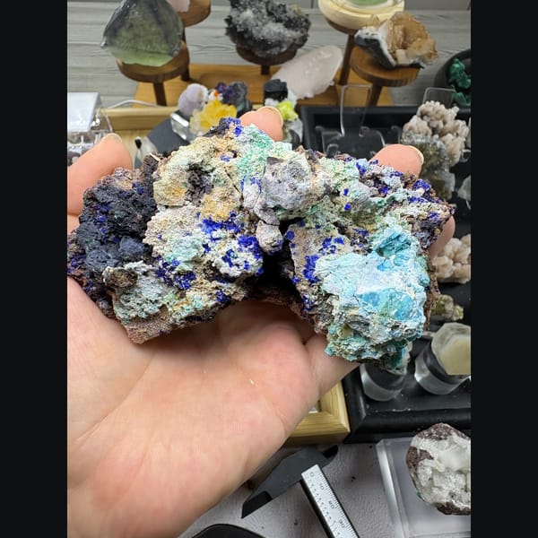 Deep blue azurite spheres with gibbsite on matrix from Qinglong, Guizhou — detail view