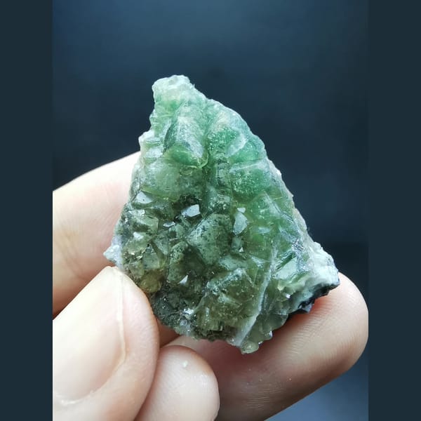 Green fluorite on calcite plates — complete view