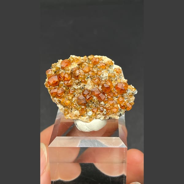 Sparkling orange-red garnet crystal cluster from Fujian — alternate view