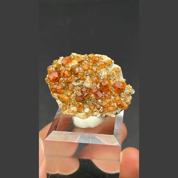Sparkling orange-red garnet crystal cluster from Fujian — alternate view