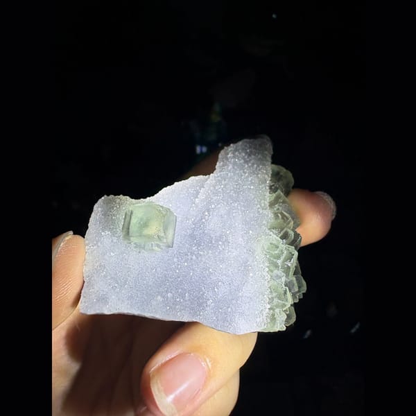 Sparkling sugar quartz with a pale green fluorite cube — complete view