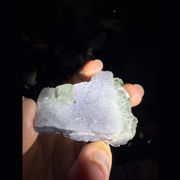 Sparkling sugar quartz with a pale green fluorite cube — alternate view