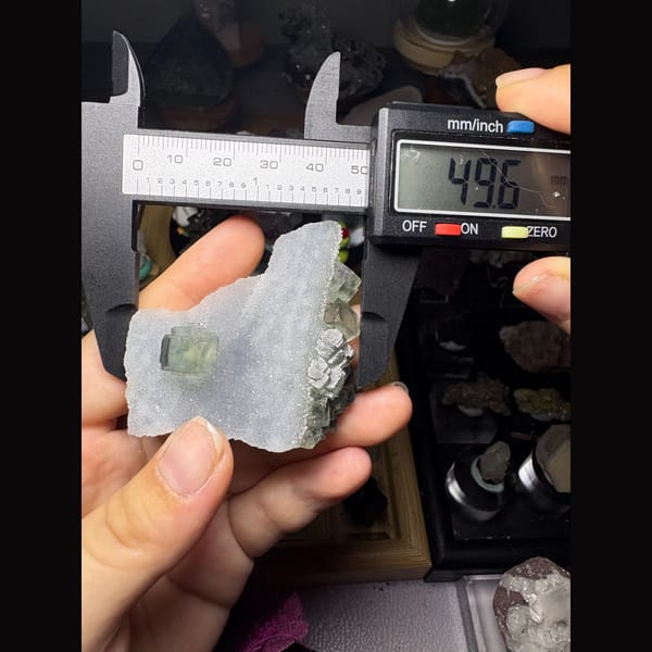 Sparkling sugar quartz with a pale green fluorite cube — alternate view