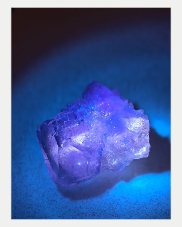 Ultraviolet-lit full view of fluorescent fluorite specimen