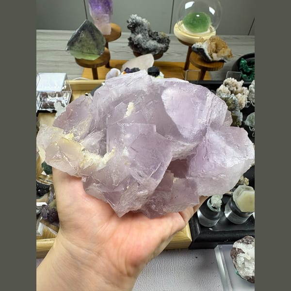 Large heavy cluster of soft lilac fluorite — complete view