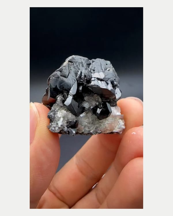 Complete underside view of cassiterite and pale matrix contact