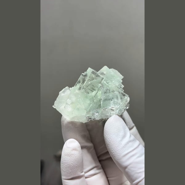 Translucent mint green cubic fluorite cluster from Zhejiang — complete view
