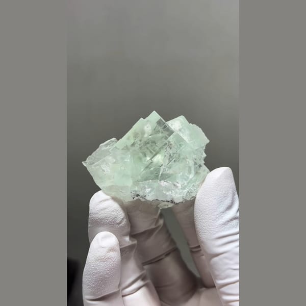 Translucent mint green cubic fluorite cluster from Zhejiang — detail view