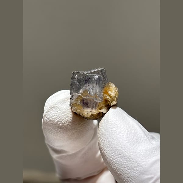 Grey-violet fluorite cube with golden mica from Yaogangxian — alternate view