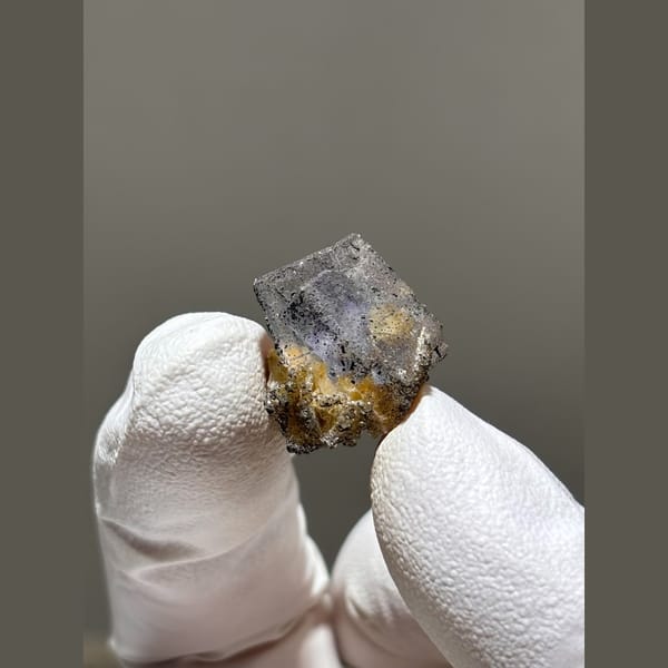 Grey-violet fluorite cube with golden mica from Yaogangxian — alternate view