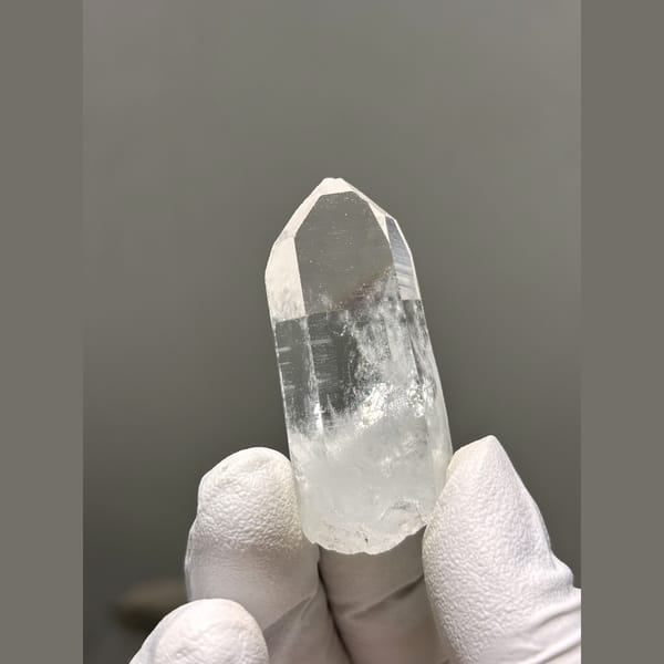 Clear quartz point with frosty base from Xuebaoding — complete view