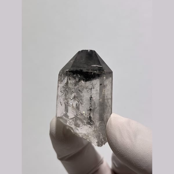 Quartz point with dark phantom tip from Jinkouhe — complete view