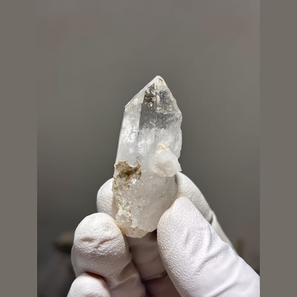 Clear quartz point with intact tip from Xuebaoding — alternate view