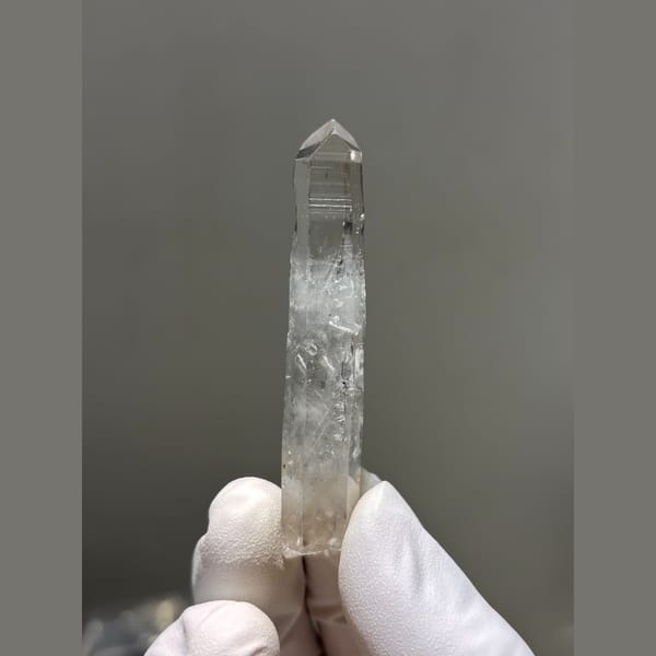 Slender clear quartz point from Jinkouhe — alternate view