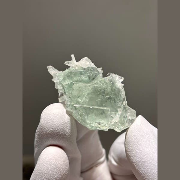 Pale green tabular fluorite with quartz from Zhejiang — detail view