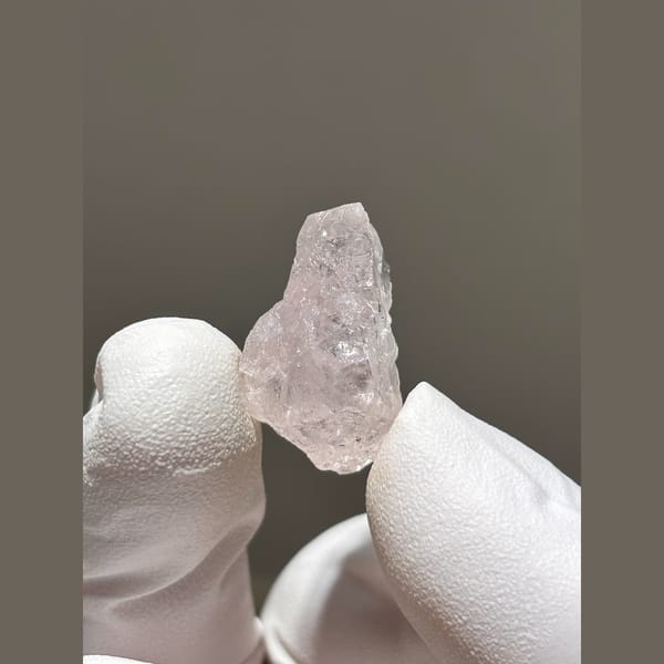 Translucent pink apatite crystal from Xuebaoding — complete view