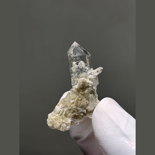 Clear quartz point with silvery mica from Xuebaoding — alternate view