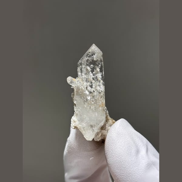 Clear quartz point with silvery mica from Xuebaoding — alternate view